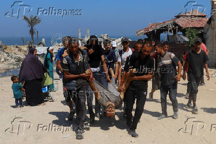 Palestinians receive aid supplies that entered Gaza through Israel, in Beit Lahia