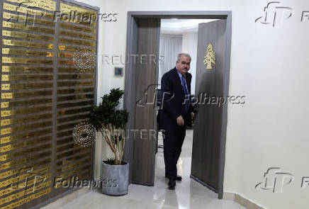 Lebanon's Finance Minister Yassine Jaber walks to attend an interview with Reuters at the Ministry of Finance in Beirut