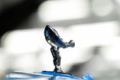 A Rolls-Royce Spirit of Ecstasy figure is seen atop a Cullinan model vehicle on the production line at Rolls-Royce Motor Cars' Goodwood