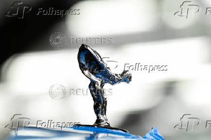 A Rolls-Royce Spirit of Ecstasy figure is seen atop a Cullinan model vehicle on the production line at Rolls-Royce Motor Cars' Goodwood