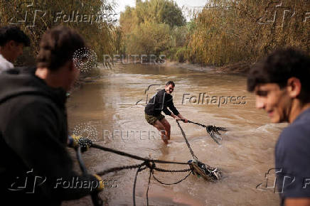 Chilean volunteers combat plastic waste in the Mapocho river, in Santiago