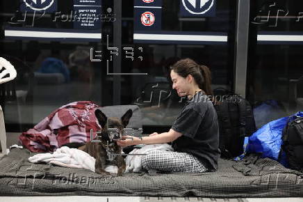 People shelter at Tel Aviv Light Rail Station amid ongoing Iranian ballistic missile threat