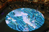 People interact with a light installation ?Digital Light Canvas? by Teamlab at the Marina Bay Sands mall in Singapore