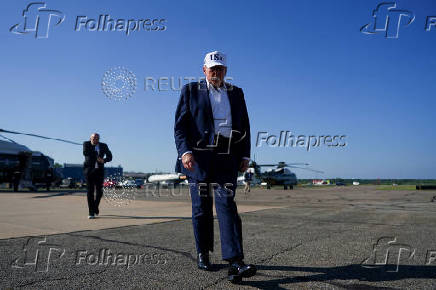 U.S. President Donald Trump walks at Morristown Airport