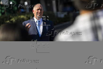 US Border Czar Tom Homan talks with news media outside the West Wing
