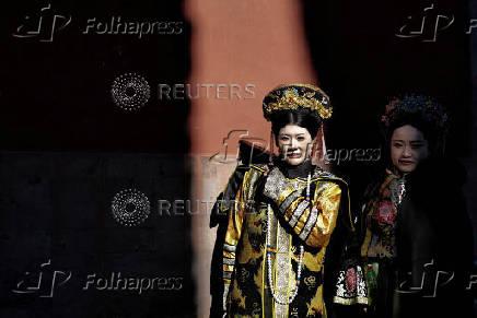 Tourists visit the Forbidden City in Beijing