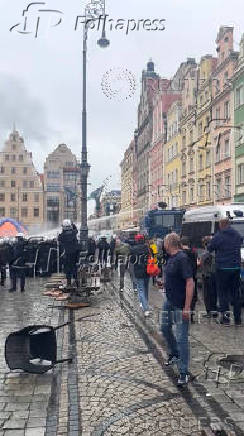 Police uses a water canon during clashes between Chelsea FC and Real Betis soccer fans, ahead of  Conference League final, in Wroclaw