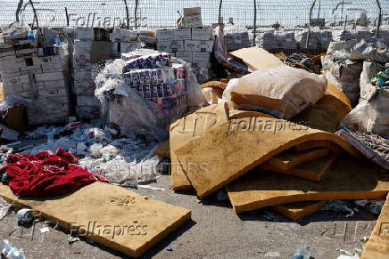 Humanitarian aid is waited to be transferred into Gaza from Israel, at the Gaza part of the Kerem Shalom crossing in the Gaza Strip