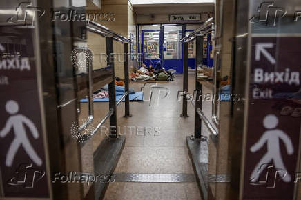People take shelter inside a metro station during an air raid alert in Kyiv