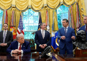 U.S. President Donald Trump signs executive orders at the White House in Washington