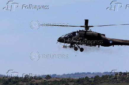 A Greek Apache helicopter flies as NATO holds training exercise 'Immediate Response' drills with host nations Albania, Bulgaria, Croatia, Greece, Kosovo, Montenegro, and North Macedonia, at Krivolak army base