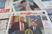 FILE PHOTO: An Iranian newspaper with a cover photo of U.S. President Donald Trump and U.S. Middle East envoy Steve Witkoff, is seen in Tehran