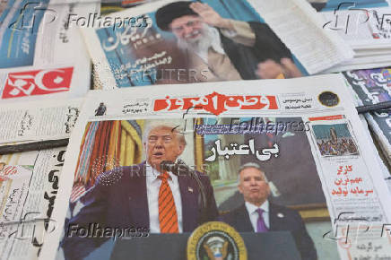 FILE PHOTO: An Iranian newspaper with a cover photo of U.S. President Donald Trump and U.S. Middle East envoy Steve Witkoff, is seen in Tehran