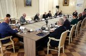 Russian President Vladimir Putin meets with heads of international news agencies in Saint Petersburg