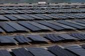 A truck passes Sembcorp Solar?s solar farm at Keppel Terminal in Singapore