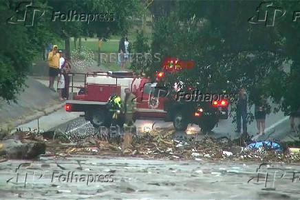 First responders survey rising flood waters of the Guadalupe River after flash flooding in Kerr County