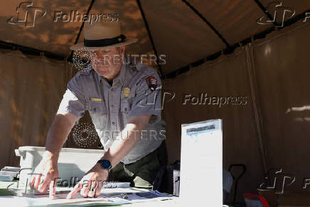 National Park Service Seasonal Interpretation Ranger Steve Northup suggests hiking routes to visitors in Yellowstone National Park
