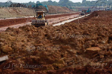 A worker operates a sheepsfoot roller at Subang Smartpolitan area in Subang