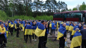 Ukrainian POWs are seen after a swap at an unknown location in Ukraine