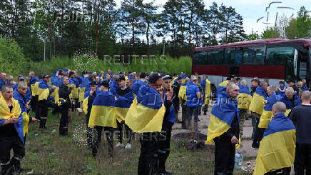 Ukrainian POWs are seen after a swap at an unknown location in Ukraine