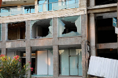 A damaged building stands in Sweida