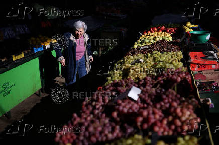 FILE PHOTO: Woman shops for food items at Krasno Selo market in Sofia