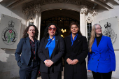 People await a ruling on an appeal by For Women Scotland outside the Supreme Court in London