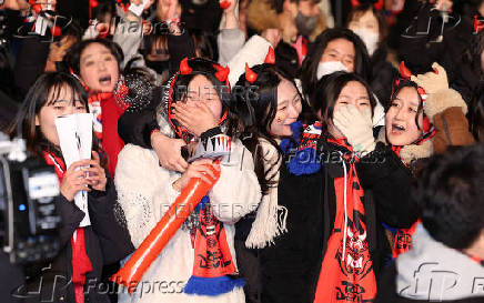 South Korean soccer fans react as they watch the FIFA World Cup Qatar 2022 match between South Korea and Portugal in Seoul