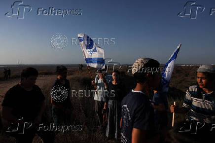 Israeli right wing activists take part in a rally organized by settlers groups to promote Israel's resettling in Gaza