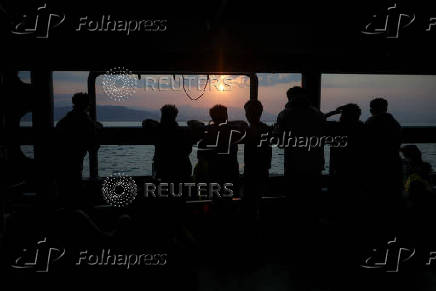 Rescued migrants arrive aboard Sea-Watch 5 ship in Salerno