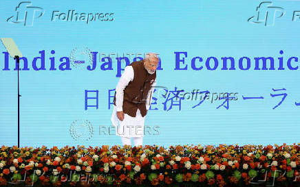 India's Prime Minister Modi bows to participants after speech at the India-Japan Economic Forum in Tokyo
