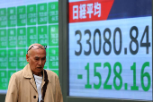 Electronic screen displaying Japan's Nikkei share average outside a brokerage in Tokyo