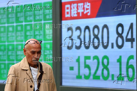 Electronic screen displaying Japan's Nikkei share average outside a brokerage in Tokyo