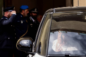 Pope Francis looks on as he leaves Regina Coeli prison after a visit, in Rome