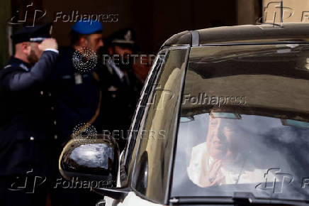 Pope Francis looks on as he leaves Regina Coeli prison after a visit, in Rome