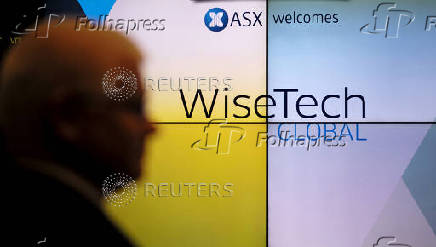 FILE PHOTO: A guest arrives at the IPO launch of Wisetech Global at the Australian Stock Exchange in Sydney
