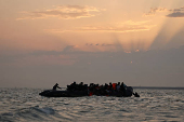Migrant dinghy heads off the French coast to cross the English channel