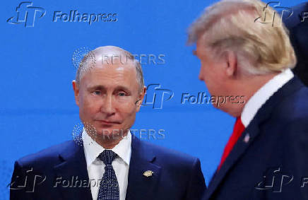 FILE PHOTO: FILE PHOTO: Putin and Trump are pictured in 2018 in Argentina