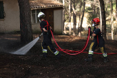 A wildfire burns in Martigues