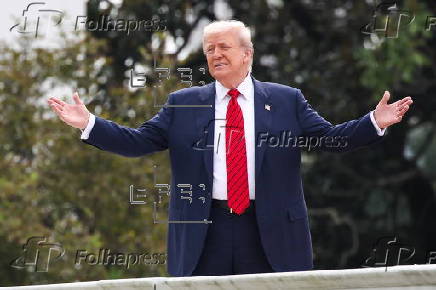 US President Trump walks on roof of the West Wing of the White House