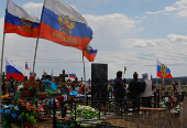 People visit a cemetery in Donetsk