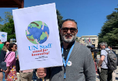 UN staff demonstrate about firing employees outside the European headquarters, in Geneva