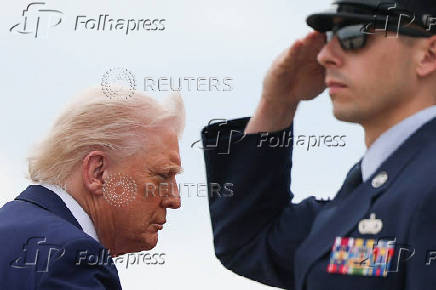 U.S. President Trump boards Air Force One, at Joint Base Andrews