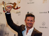 FILE PHOTO: Austrian space jumper Baumgartner poses with his trophy after the 64th Bambi media awards ceremony in Duesseldorf