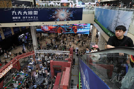 People visit Shanghai World Expo Exhibition and Convention Center during WAIC in Shanghai