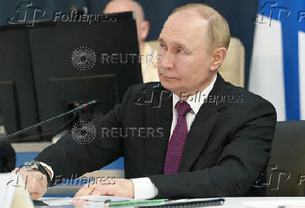 Russian President Putin observes naval drills via video link from Saint Petersburg