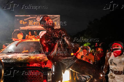 Revelers attend J'ouvert celebration on the day of the annual West Indian Day parade in the Brooklyn borough of New York