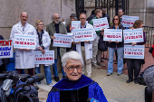 Members of Columbia Medical staff and faculty protest against federal funding cuts at Columbia University in New York
