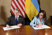 U.S. Treasury Secretary Bessent and Ukrainian First Deputy Prime Minister Svyrydenko sign a deal in Washington