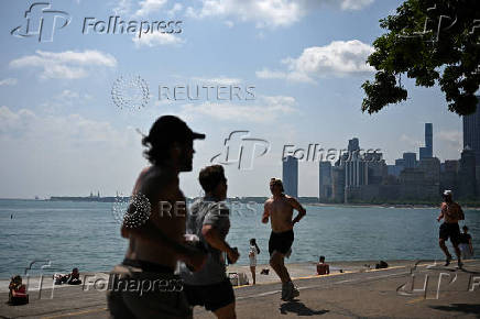 People jog along the front in Chicago